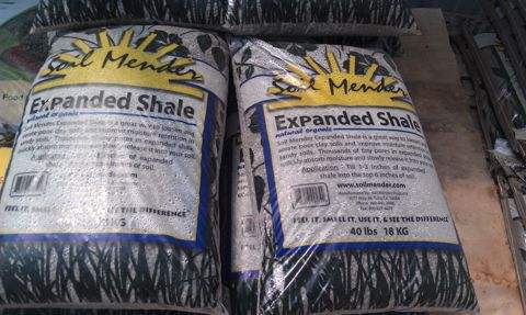 Bagged soil amendments stacked for sale